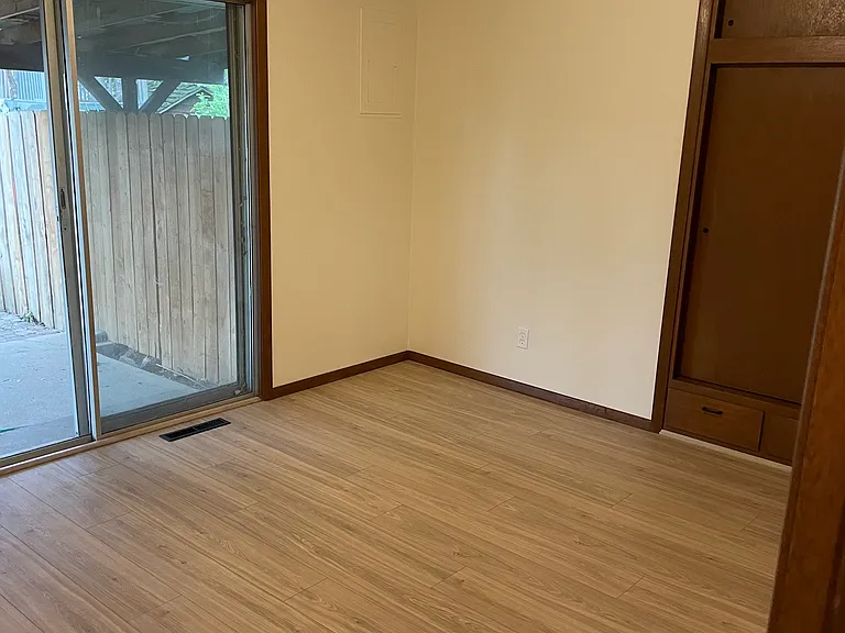 Sliding door to back yard off larger bedroom. Retro ceilings in bedrooms.