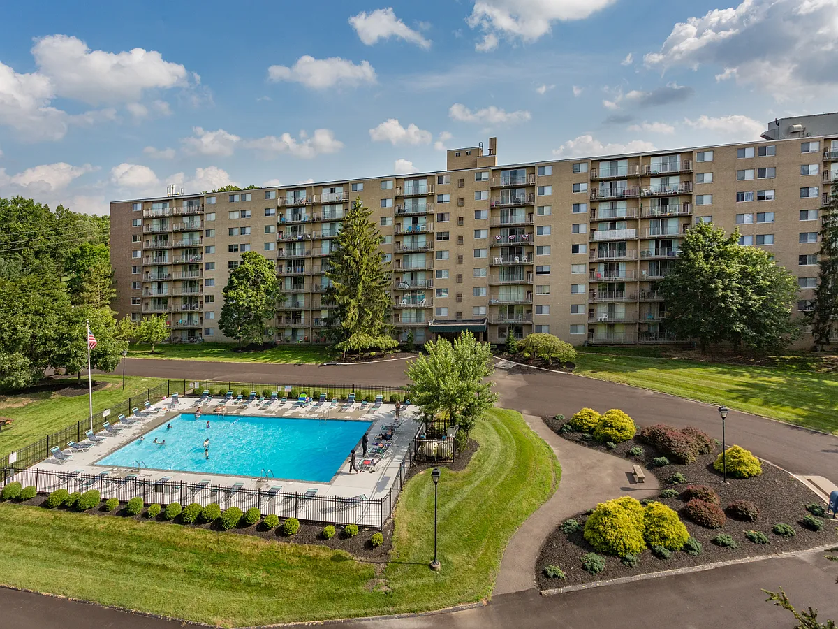 Take a dip in the refreshing pool. - Portage Towers Apartments