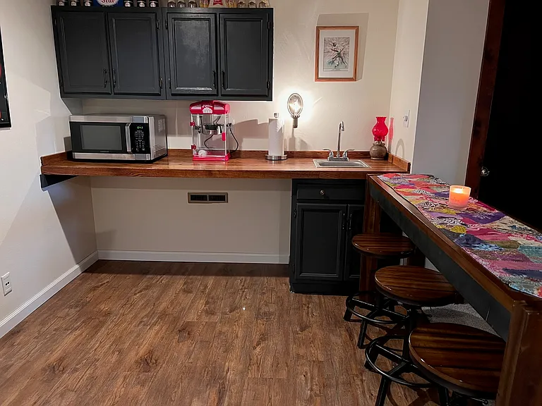 Open bar/kitchen area in basement floor.