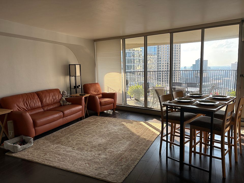 Spacious living room with high-top drop leaf dining table seating four