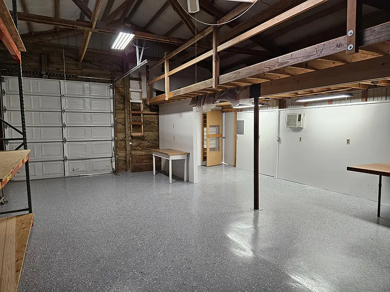 detached garage looking W manual garage door.