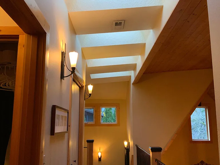 Upper hallway with 5 skylights, closets.