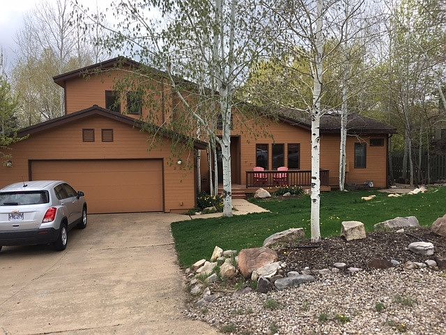 Home has beautful landscaping and aspen trees.