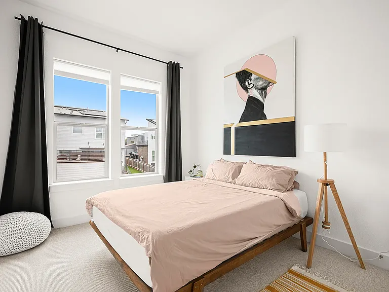 Both secondary bedrooms are generously sized with abundant natural light and share a well-appointed full bathroom, making them ideal for family, guests, or a home office.