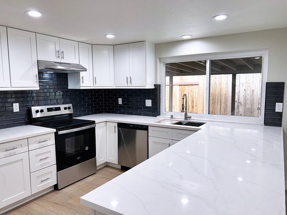 BRAND NEW modern kitchen with granite countertop, shaker cabinets with soft-close drawers, appliances, 16-gauge sink and commercial faucet!