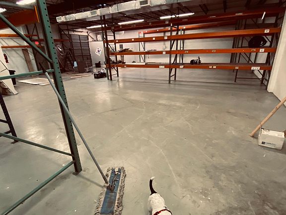 Looking to southwest corner with loading dock garage door in corner.