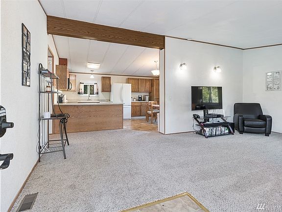 Into the living room with it's newer carpet.