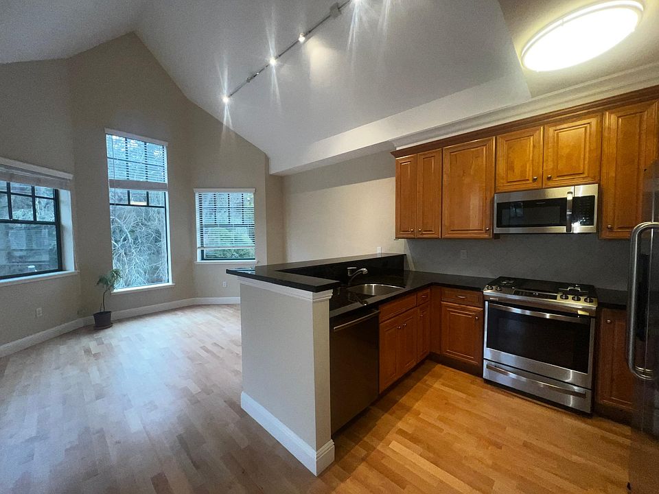 kitchen with dishwasher, oven, fridge and hood microwave