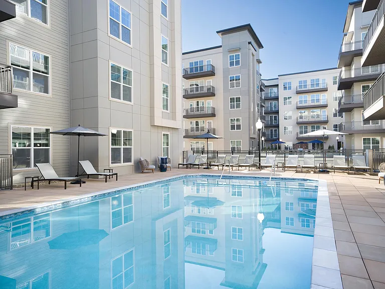 Our resort-inspired pool at Modera Liberty Row offers space to unwind, lounge poolside, and enjoy warm Charlotte days from home.