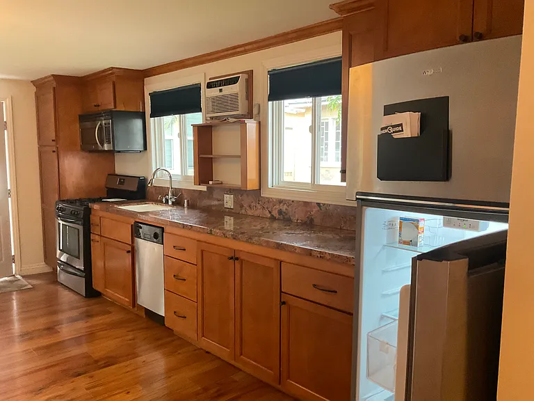 Kitchen with granite counter stainless steel appliances
