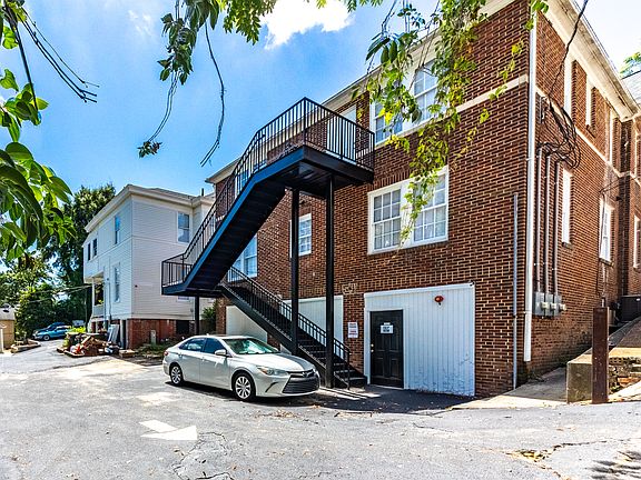Back of the house with private parking.