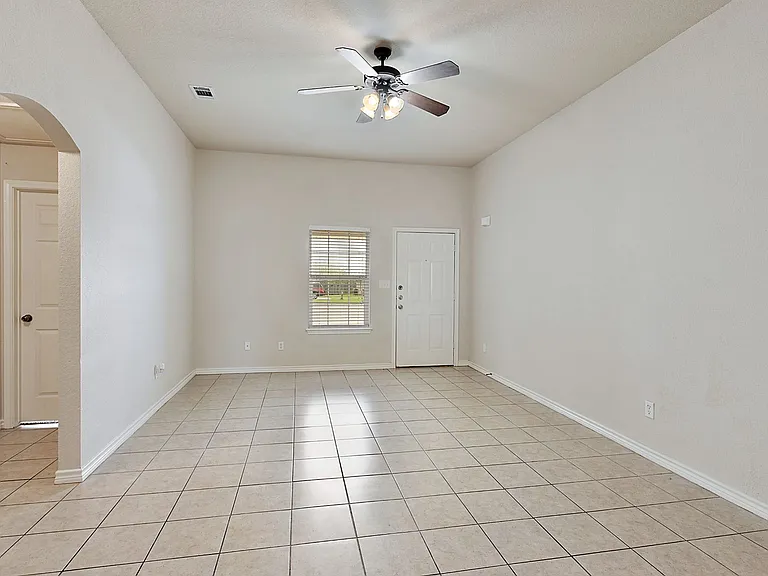 The living, dining, and kitchen, & all bathrooms are tiled. 9 foot ceilings. ceiling fans in each room, 2 inch faux wood blinds on all windows.