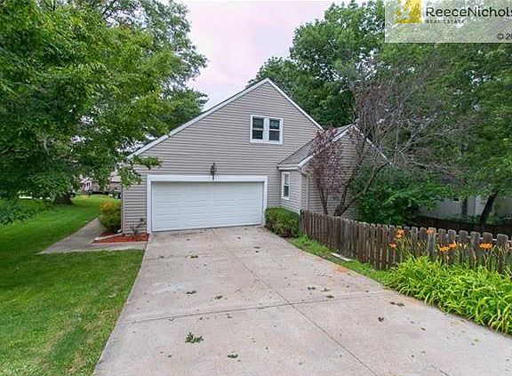 The lot sits on a treed corner lot, side entry garage.