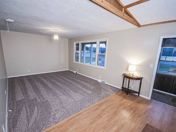 The living room (12 X 23) is perfect for entertaining and has brand new carpet and a large window with western exposure to capture the beautiful sunsets.