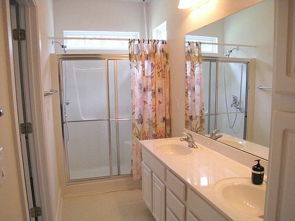 Dual sinks and walk-in shower in master bath