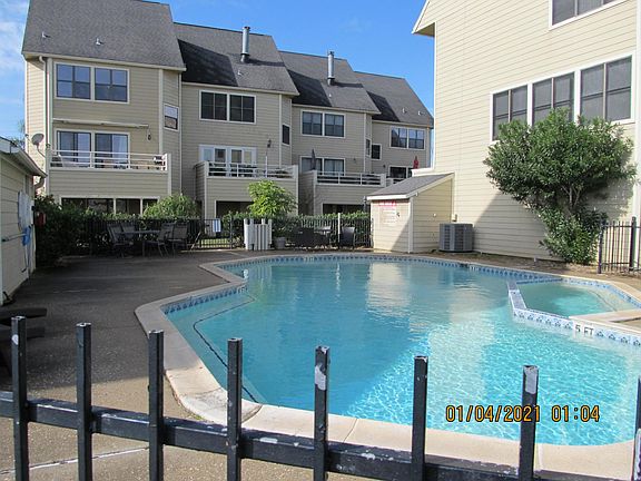 View of pool and side of house