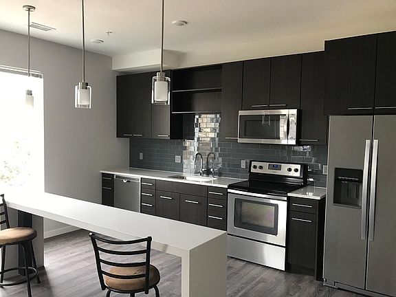 Open kitchen with built-in bar top counter