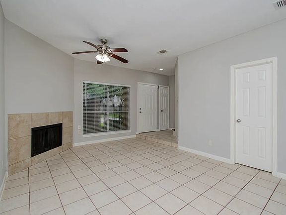 Tile floor living room with fireplace