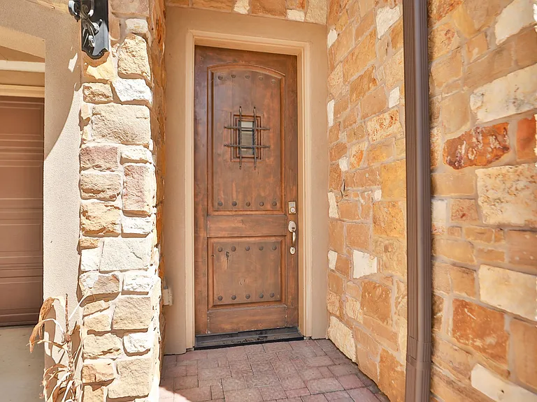 Gorgeous Front Door with Ornate peek through window.