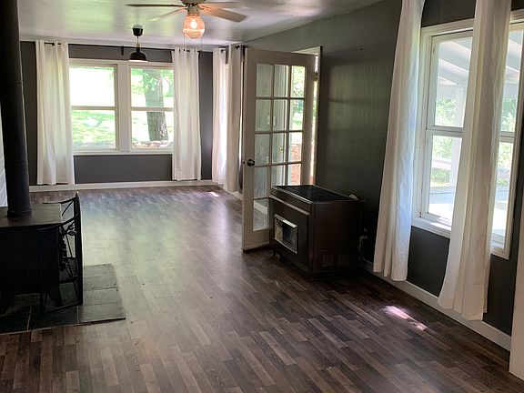 Wood stove and propane heater between the dining area and the living room
