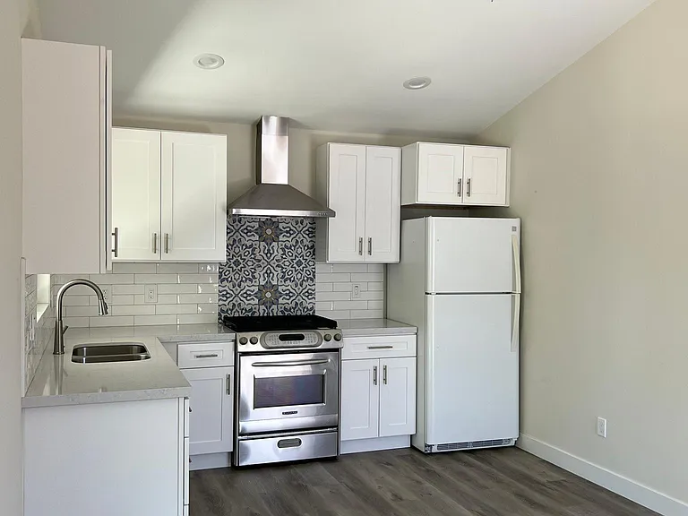 Gas stove and full refrigerator.
