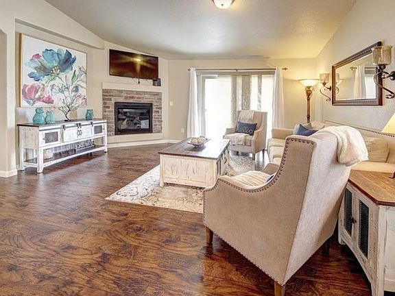 Comfy Main Level Living Room with fireplace and slider to small courtyard