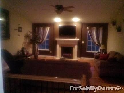 Living room
						:
						Beautiful gas fireplace tops off relaxing living room