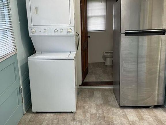Back room contains washer-Dryer, Fridge, Pantry, and room for a small table.
