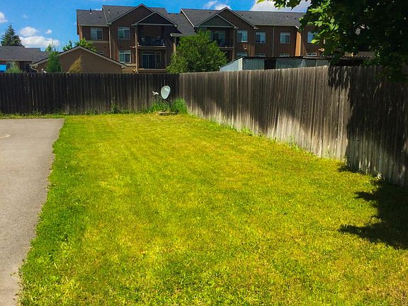 Front yard shared space and parking to right
