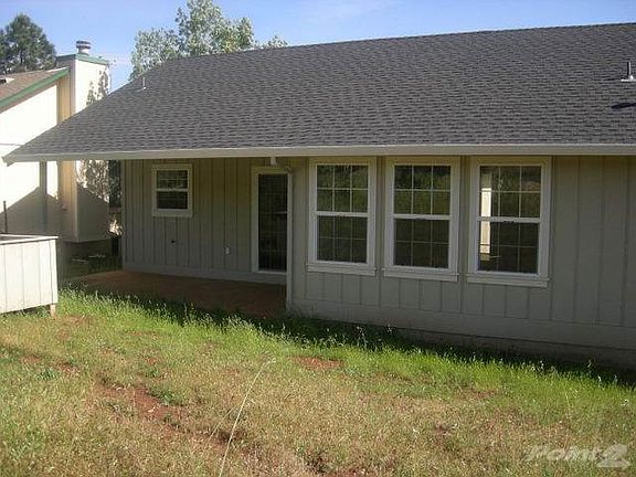 Back side with covered patio Raven Hill