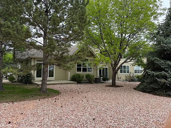 Enjoy the view of the private patio and master bedroom window overlooking a serene, open backyard. This peaceful outdoor space offers beautiful scenery and complete privacy-all with no maintenance required.