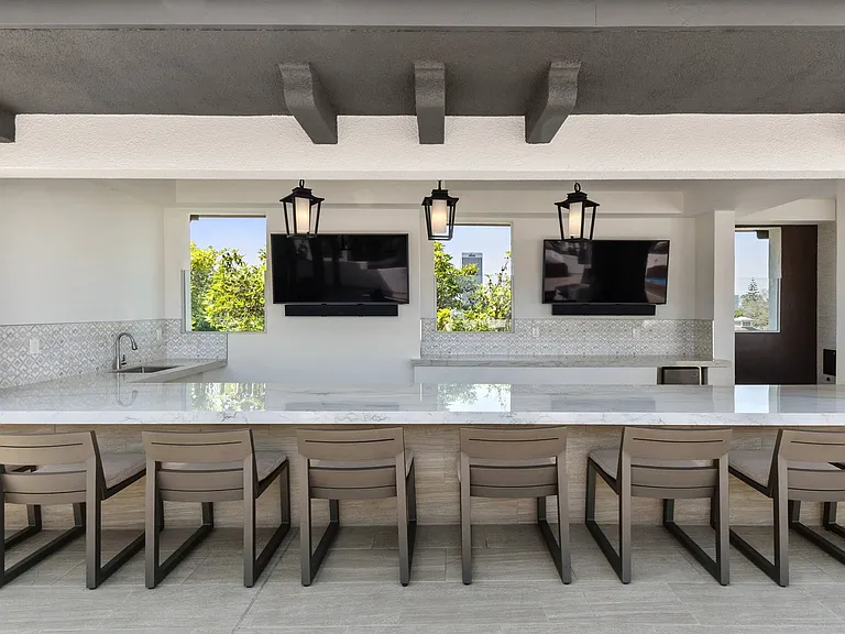 Exclusive rooftop deck features TVs