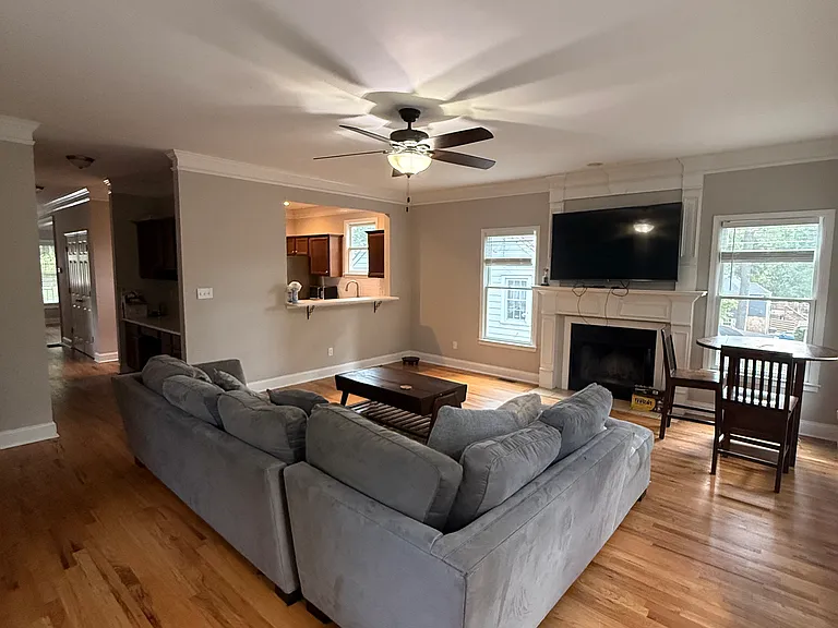 living room with kitchen / hallway view