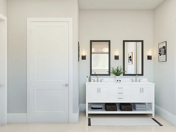 Primary bath featuring freestanding vanity with dual sinks