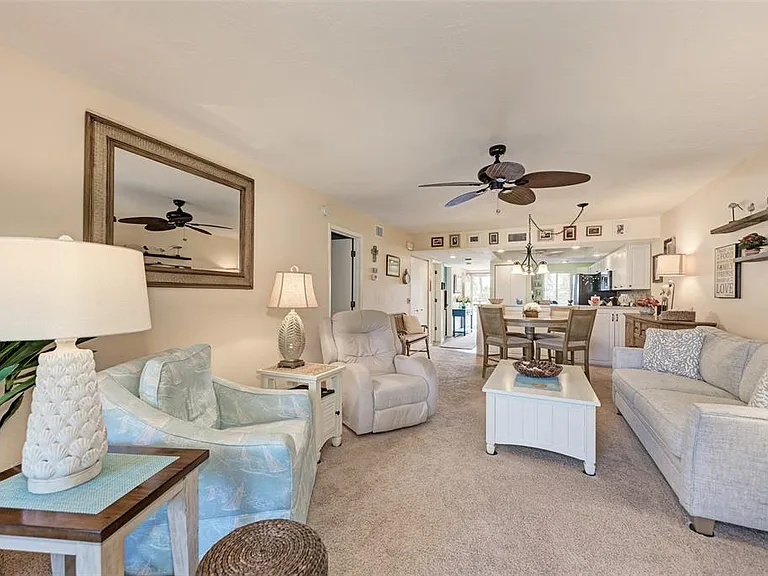 Your soft landing in paradise. __ We've designed our living room with comfort as the top priority. With plush carpet underfoot and plenty of seating for the whole family, it's the perfect spot to kick back, relax, and recap the day's adventures.