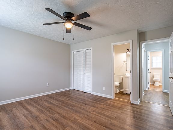 Spacious primary bedroom with ensuite half bath and dual size closet