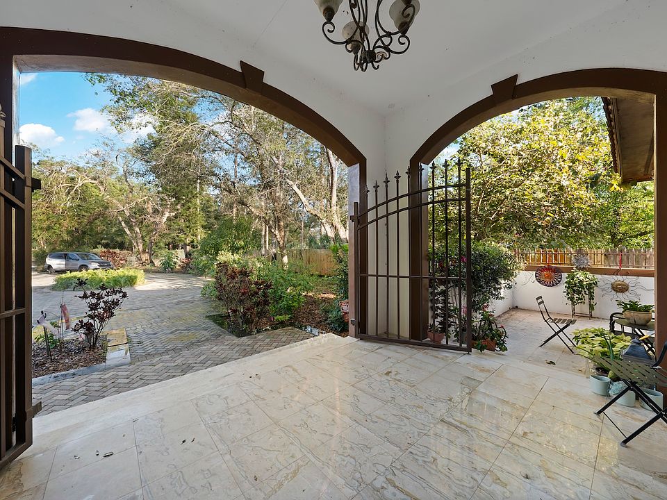 Beautiful porch flanked by 2 private patios just outside the front bedrooms through private, sliding doors