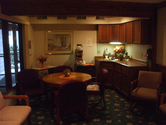 community room with short kitchen