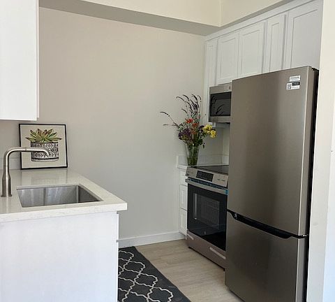 All new stainless steel appliances include refrigerator with built in water dispenser and ice maker, electric stove, microwave hood, compact dishwasher.