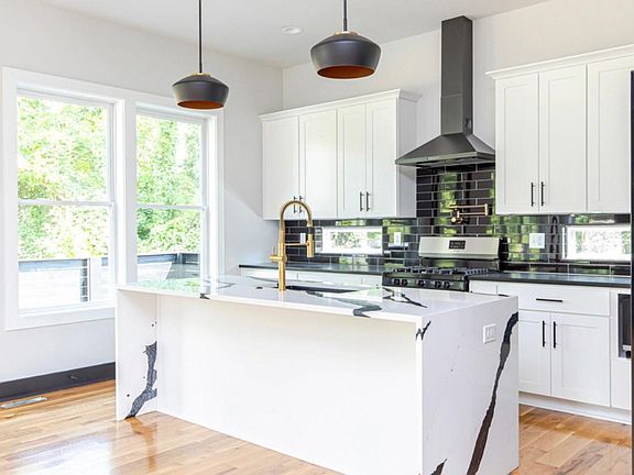 Gourmet kitchen, large island, and brand new appliance package.