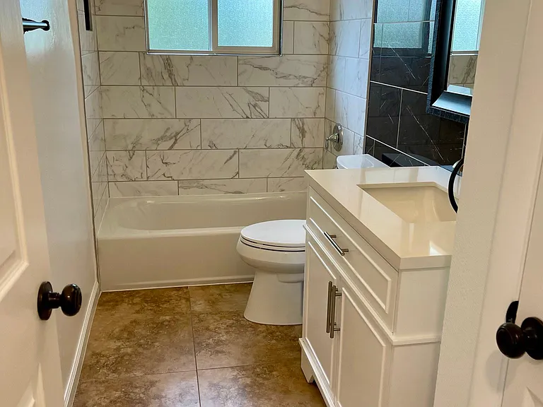 Main floor hallway bathroom. Custom tile work.