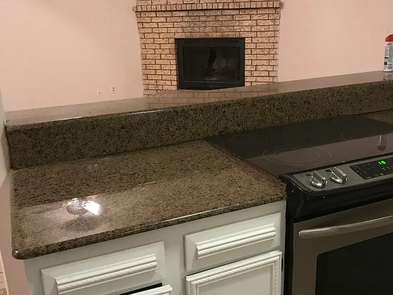 kitchen looking into livingroom w/fireplace