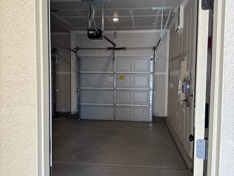 View of 1-car garage bay from garage door.