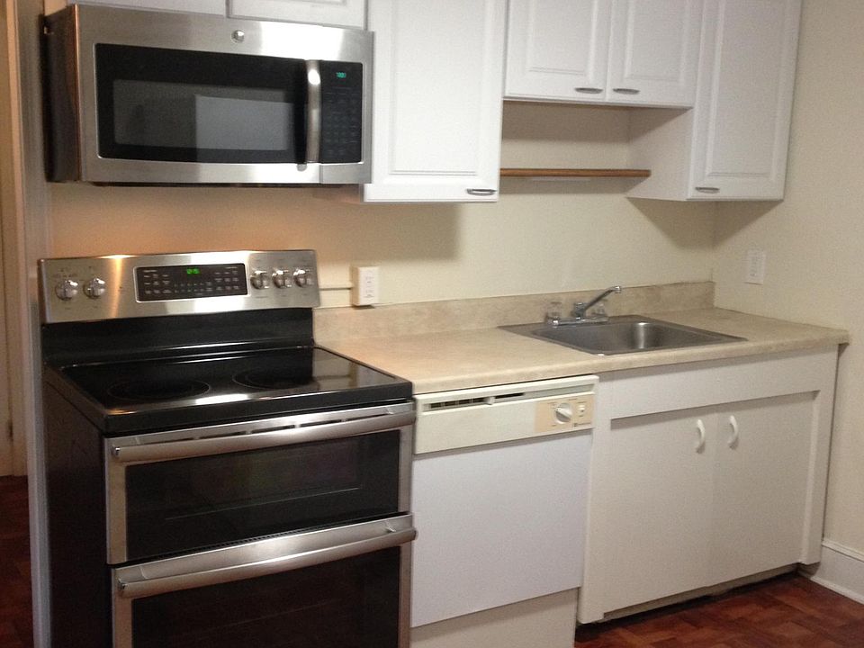 Kitchen. Contains new microwave and electric stove with double oven, new dishwasher (not in picture) garbage disposal, water filtration system, in unit laundry, collapsible wall pull out table.