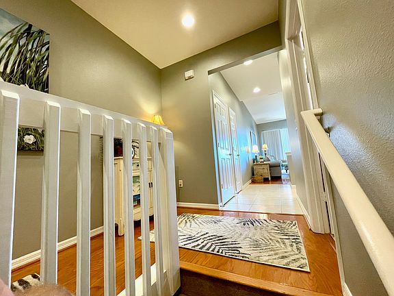 top of stairs looking toward kitchen, family room, lanai