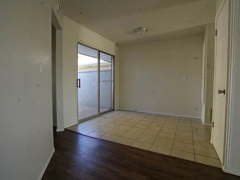 Dining Area: Natural light with access to private fenced yard