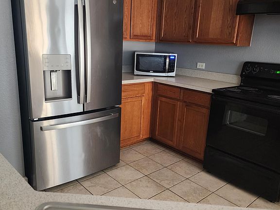 New refrigerator. On the counter Microwave.