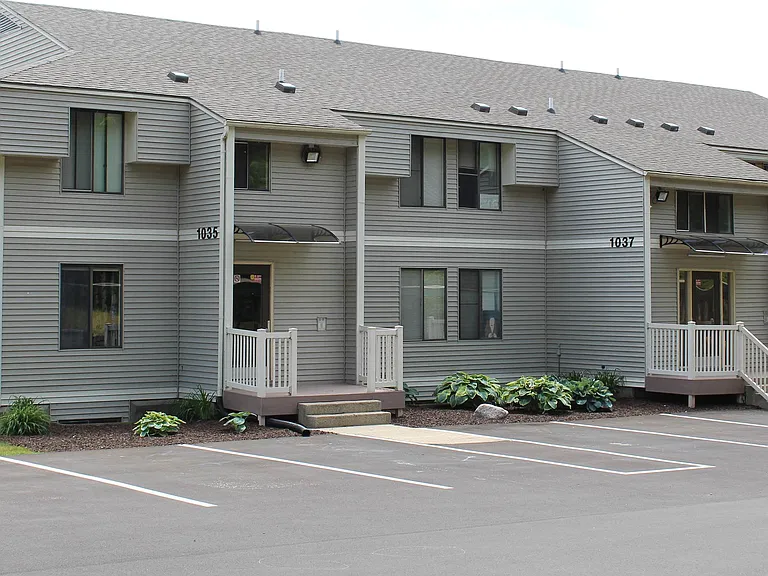 Exterior, three hall entries per building.
