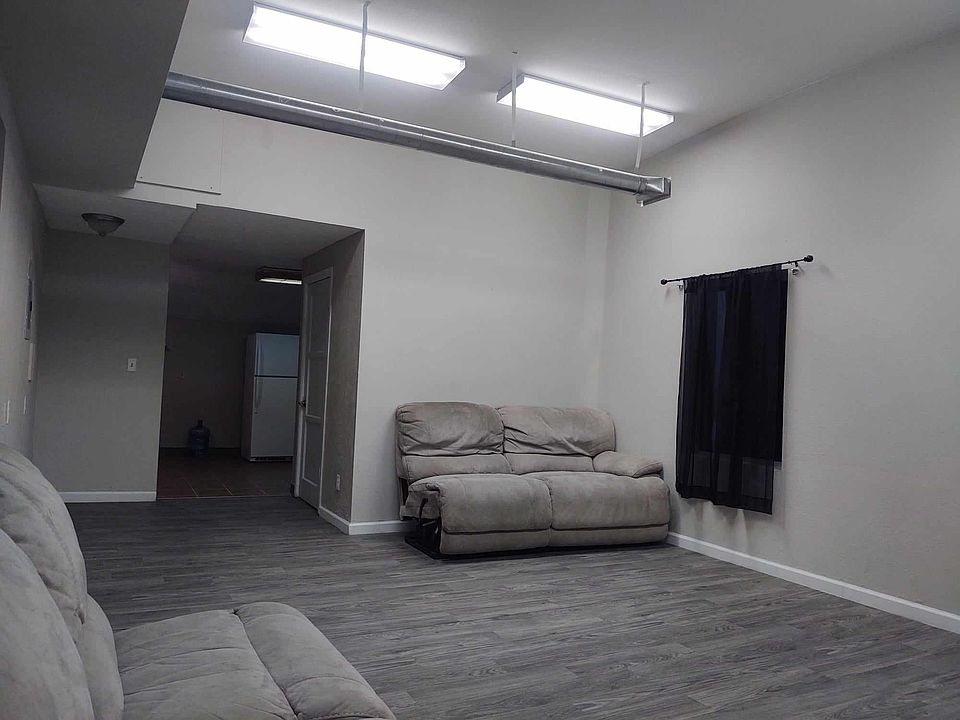 Living room with entrance to kitchen