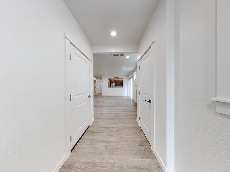 Entry, with door to garage on left & coat closet on right.
